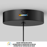A black ceiling-mounted light fixture with a color temperature switch, featuring five selectable settings. Text below reads: Colour Temperature Switch in English, French, and Spanish.