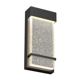 A modern rectangular wall sconce with a black frame and a clear panel filled with small bubbles, illuminated by LED lights around the edges.