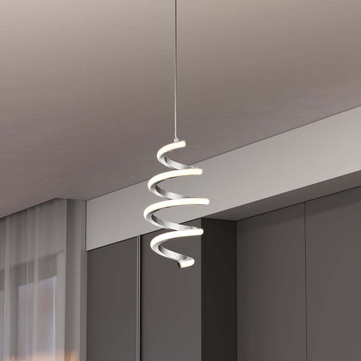 A modern spiral LED pendant light with a sleek, white design hangs from the ceiling in a contemporary room with dark cabinets and sheer curtains.