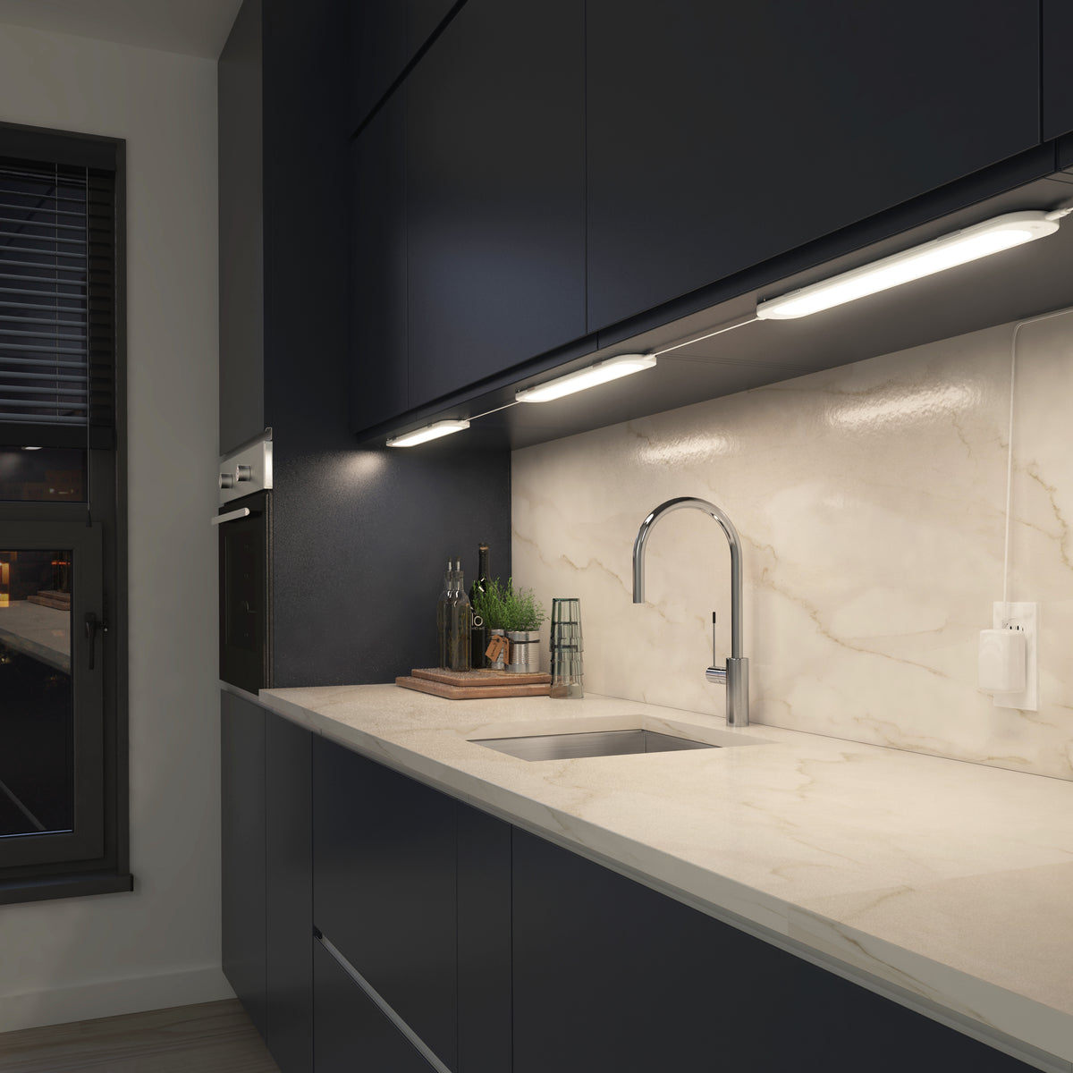 Modern kitchen with dark cabinets, marble backsplash, Artika Impulse Under-Cabinet LED RGB+CCT lights, and a tall-faucet sink.