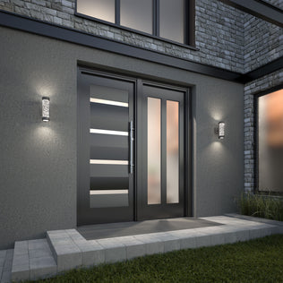 Modern front entrance with a matte black double door with horizontal glass inserts, frosted side panel, and Artika Bubble Element LED indoor-outdoor lights mounted on both sides, plus a stone pathway leading to the door.