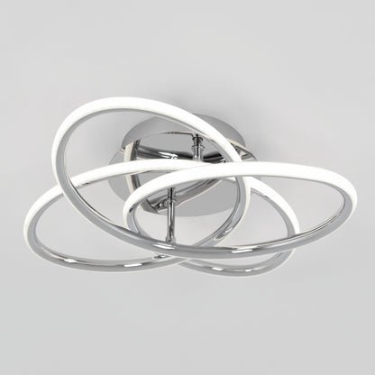 The Swirl Butterfly LED contemporary flush mount light by Artika features interlocking chrome rings with integrated LEDs on a round metallic base, shown here against a plain white background.