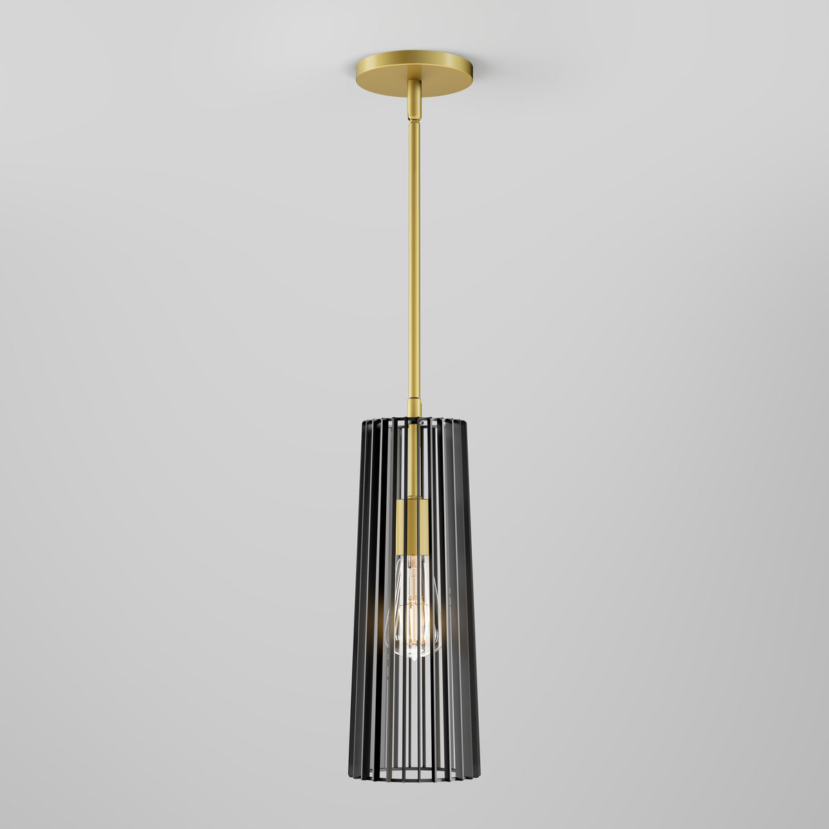 A modern pendant light with a gold rod and ceiling mount, featuring a cylindrical black metal cage shade and an exposed light bulb inside, set against a plain light gray background.