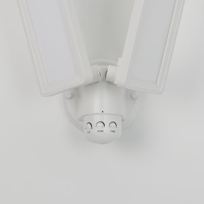 The Artika Sentinel outdoor Flat Panel Security light is a white LED floodlight with two adjustable rectangular panels and three control dials (LUX, SENS, TIME), mounted on a white wall.