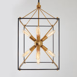 A modern pendant light with a geometric, open-frame rectangular design in black and brass, featuring a central brass sphere with six exposed Edison bulbs radiating outward in a star-like pattern.