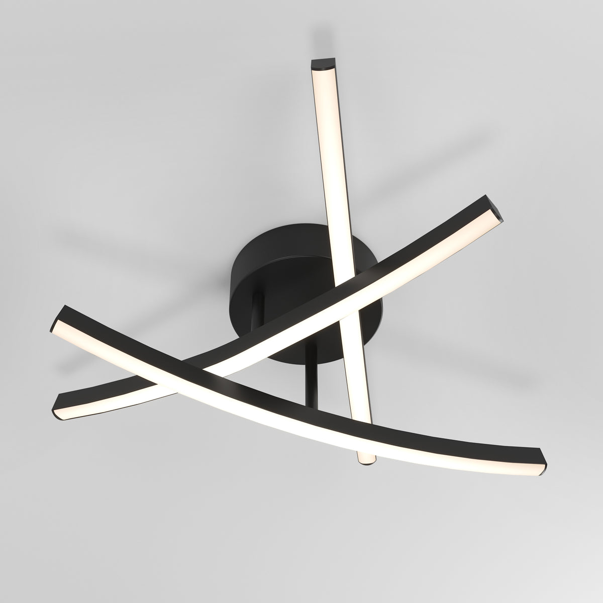 Modern ceiling light fixture with three curved, intersecting LED bars attached to a round black base, mounted on a white ceiling. The bars emit a soft, even glow.