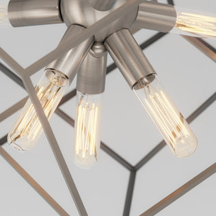 Artika Imperium 9-light chandelier with exposed Edison bulbs in a geometric frame, glowing against a plain background.