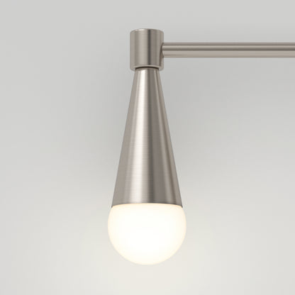 The Artika Wayden LED mid-century bathroom vanity light 3 CCT features a brushed metal cone-shaped base and a round frosted white bulb, mounted on a metal rod against a plain light gray background.