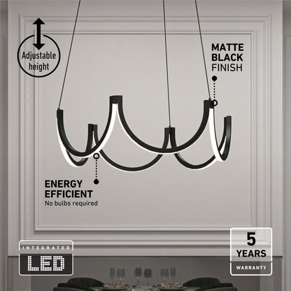 The Adelia LED pendant light by Artika, featuring a matte black finish and curved arms, hangs over a dark table in a minimalist room. Text highlights its adjustable height, 5 CCT settings, energy efficiency, integrated LED, and 5-year warranty.