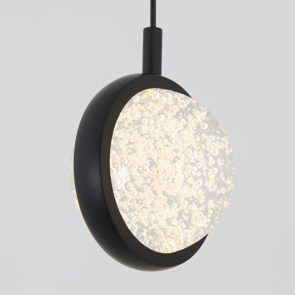 The Artika Avalon 4-light LED pendant features round, bubble-filled glass shades partially encased in black frames, suspended from black cords against a plain light gray background.