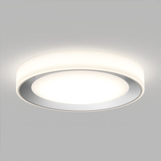 The Artika Cooper LED flush mount light features a glowing white center, smooth round design, and includes a remote.