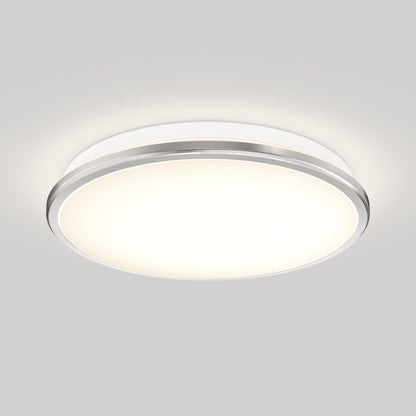 The Artika-CAN-dev Vera 13 in. LED modern flush mount light features a round frosted white cover, slim silver rim, LED dimmer compatibility, and emits a soft, even glow when mounted on a plain white ceiling.