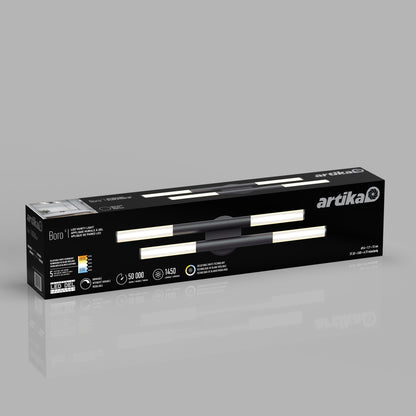 A black rectangular box for the Artika Boro LED modern bathroom vanity light 5 CCT is displayed. The packaging shows the fixture image, product info, and branding on a reflective gray surface.