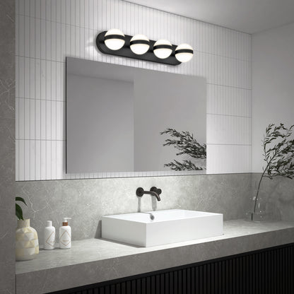 Modern bathroom with a large rectangular mirror, white vessel sink, matte black faucet, and the Artika Baldric LED modern bathroom vanity light 3 CCT. Minimalist decor includes two bottles, a vase, and a leafy branch on a gray countertop.
