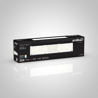A black rectangular box for the Artika Subway Essence 3 LED bathroom vanity light displays an image of the three-light fixture and product details on the packaging, all set against a white background.
