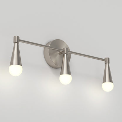 The Artika Wayden LED mid-century bathroom vanity light 3 CCT features three brushed nickel arms with cone-shaped holders and frosted round bulbs, showcased on a plain white wall.