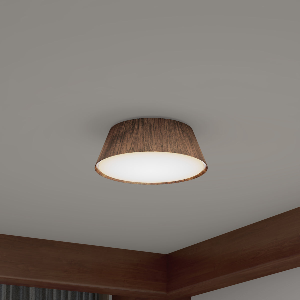 A modern ceiling light with a round wooden shade and soft white illumination, mounted on a white ceiling with wood trim visible in the corner of the room.