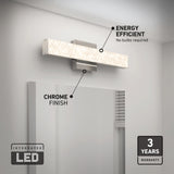 A modern LED vanity light with a chrome finish is mounted above a mirror. Text highlights its energy efficiency, chrome finish, integrated LED, and 3-year warranty. The setting is a contemporary bathroom.