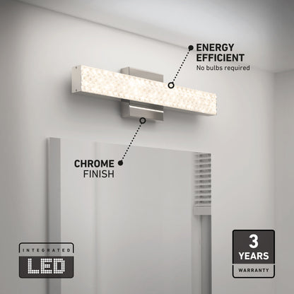 The Adeline modern LED bathroom vanity light by Artika, with a chrome finish, mounts above your mirror. Featuring 3 CCT selectable LEDs, it’s energy efficient, requires no bulbs, and includes a 3-year warranty badge in the corner.