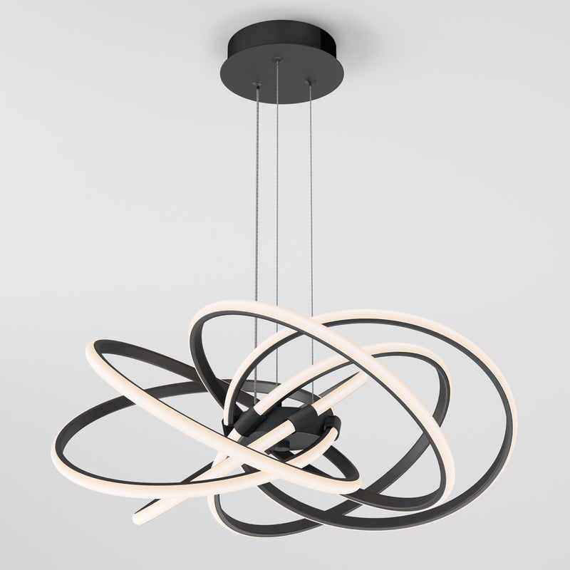 The Artika Maelstrom LED pendant light features intertwined black rings with integrated LED strips, suspended by three thin cables, shown against a plain white background.