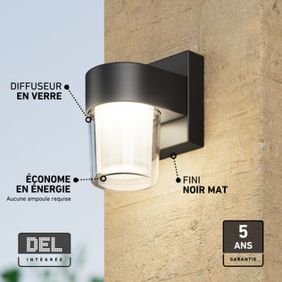Artika Halden indoor-outdoor LED wall light 5 CCT with a glass diffuser and matte black finish mounted on a stone wall.