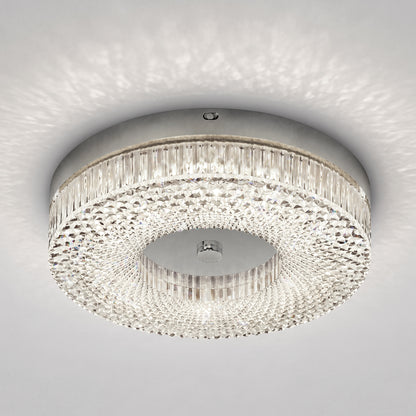 Artika FM Lysara 15 in. LED Fashion Flush Mount Ceiling Light 5 CCT with a faceted crystal ring and a polished metal center.
