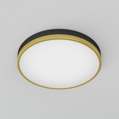 The Artika Kent LED flush mount light has a modern round design with a white center, gold outer rim, and black edge accent, shown mounted on a light gray ceiling.
