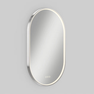 Artika Royce LED mirror 3 CCT with defogger, oval-shaped, thin light border, memory function, on a plain light gray wall.
