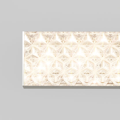 The Adeline modern LED bathroom vanity light by Artika features geometric faceted crystals and emits bright, warm white light against a plain light gray background.