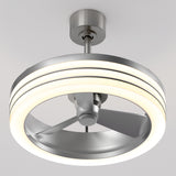 A modern ceiling fan with three metal blades enclosed in a circular LED light fixture, mounted on a white ceiling. The design is sleek and contemporary, combining lighting and airflow in one unit.