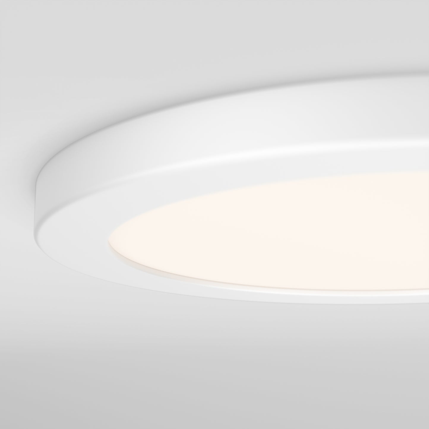 A close-up of the Artika Europa Disk 9 in. LED modern flush mount light, illuminated in a round, white design against a smooth light gray ceiling. Features 3 selectable color temperatures (CCT).