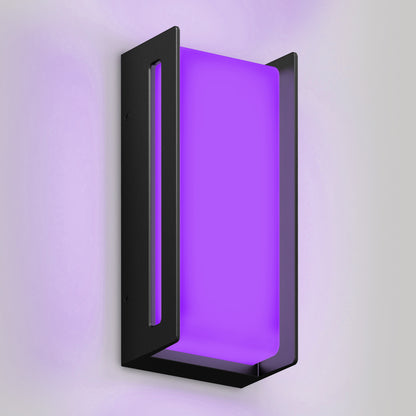 The Artika Ryker smart RGB indoor-outdoor wall light is a modern black sconce with a rectangular open-frame design, shown mounted on a light gray wall and glowing purple at its center.