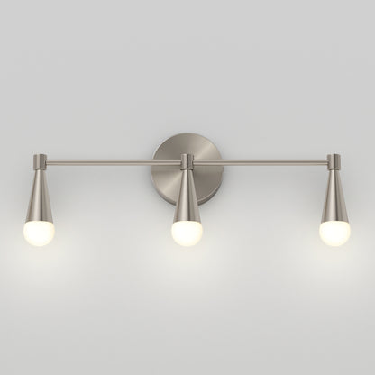 The Artika Wayden LED mid-century bathroom vanity light features three brushed metal cone arms, each with a round white bulb, all mounted on a circular base against a light gray wall.