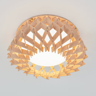 The Artika Kiran 13 in. modern LED flush mount light features a geometric, lattice-patterned wooden shade around a glowing white bulb, and is designed for easy installation on a white ceiling with 5 selectable color temperatures (CCT).
