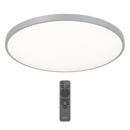 The Artika Jupiter 23 in. LED flush mount light, featuring a round modern design with a silver frame, is pictured above its black remote control, which offers multiple buttons for easy light adjustment.