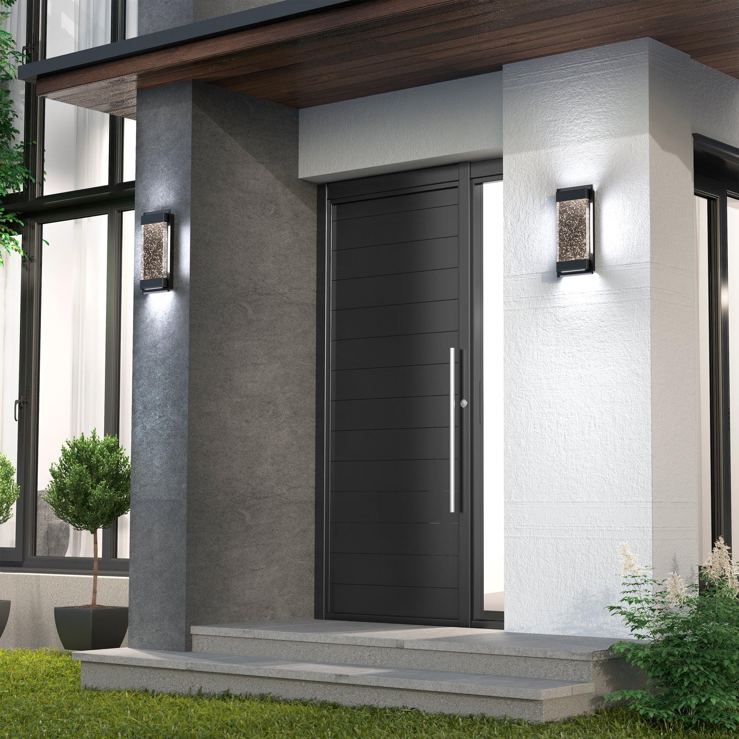 Modern house entrance with a sleek black door, tall handle, and two Artika Essence Glow Box indoor-outdoor LED wall lights illuminating the entry. Concrete steps and potted shrubs enhance the doorway.