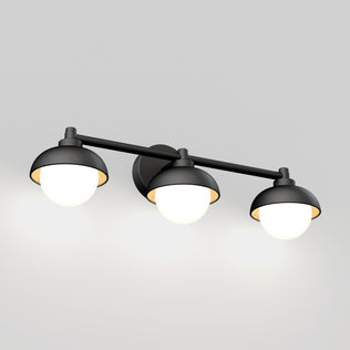 The Artika Boden 27-in (69 cm) Integrated LED 5-CCT Vanity Light Bar features three black and white round lampshades on a horizontal rod, each offering adjustable color temperature for a warm glow—ideal for modern bathrooms.