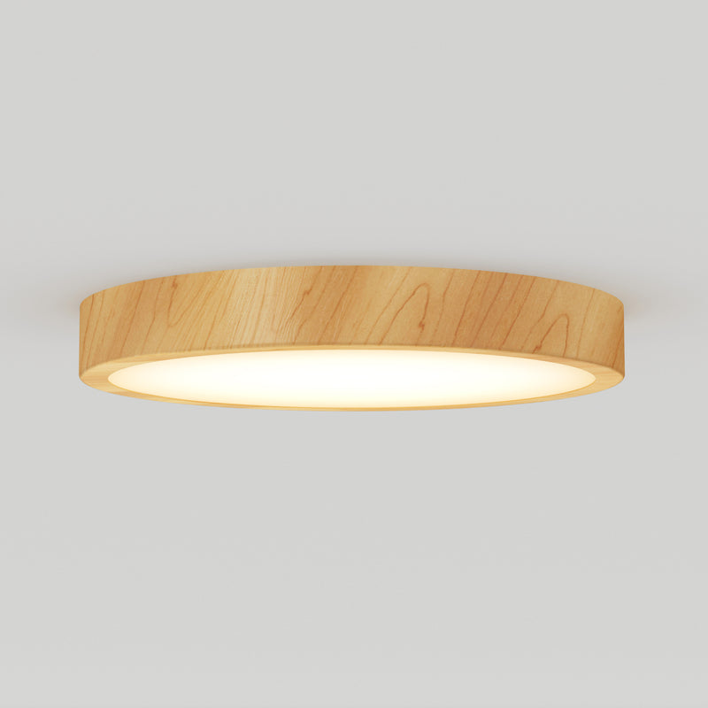 The Artika Dryad 15 in. LED Modern flush mount light features a round wooden frame and a soft white illuminated surface, creating a stylish look on any light-colored ceiling.