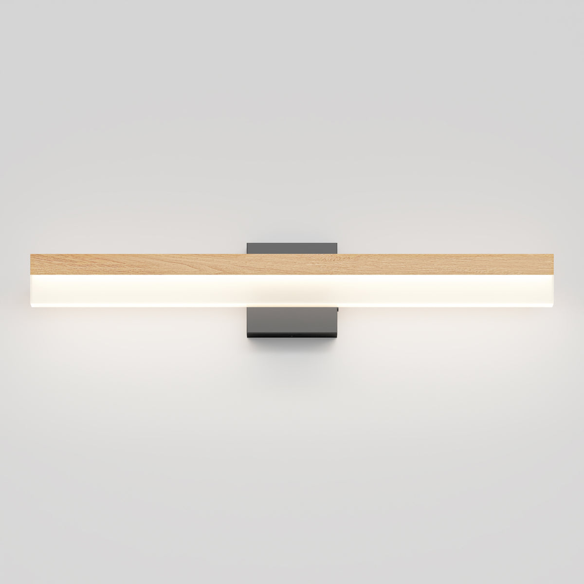 A modern wall-mounted light fixture with a horizontal wooden accent on top and a white illuminated bar below, attached to a rectangular black base against a plain light gray wall.