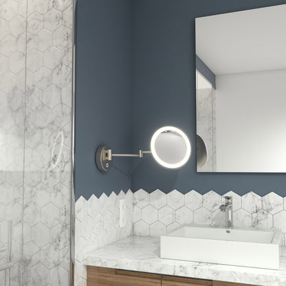 Modern bathroom with hexagonal white tile walls, a rectangular sink on a marble countertop, and an Artika Radia Cordless LED Cosmetic Mirror, plus a partial view of a large mirror and shower area.