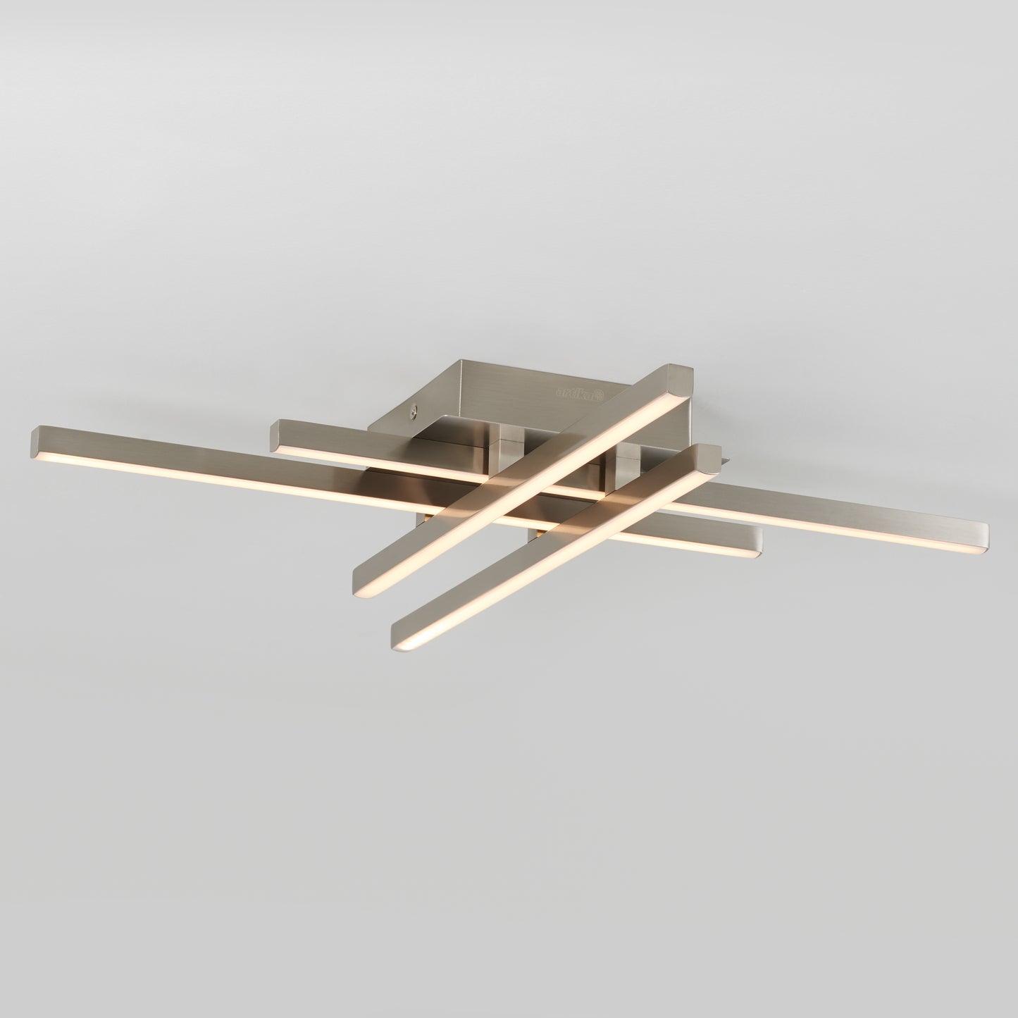 The Artika Grid LED flush mount features four intersecting horizontal bars illuminated by LEDs, all mounted on a square metallic base against a plain light gray background.