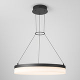 A modern, circular pendant ceiling light with a black frame and glowing white diffuser, suspended by four thin cables from a round black ceiling mount against a plain light gray background.