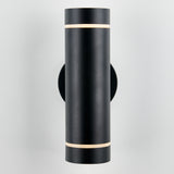 A modern, cylindrical black wall sconce with thin horizontal light bands near the top and bottom, mounted on a light gray wall.