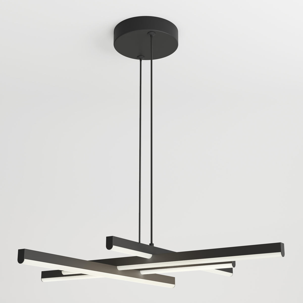 Modern black chandelier with three elongated, intersecting LED light bars suspended from a round black ceiling mount by two thin cords, set against a white ceiling background.