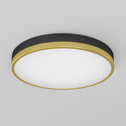 The Artika Kent LED flush mount light features a modern round design with a black edge, gold trim, and large white illuminated center, shown mounted on a plain light gray ceiling.
