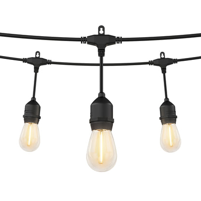 The Artika Blaze 20 LED Outdoor Solar String Lights feature weather-resistant black sockets and vintage-style glowing bulbs, suspended from black wires, shown against a white background.
