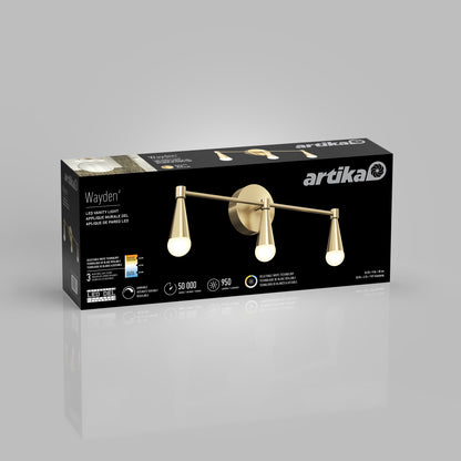 A product box for the Artika Wayden LED mid-century bathroom vanity light 3 CCT is shown on a gray background, featuring an image of the fixture with three gold arms and bulbs, along with product details and icons.