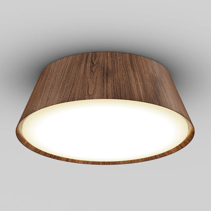 The Artika Dunham 15 in. LED flush mount light features a modern circular wooden frame and a glowing white diffuser, offering 5 CCT options, and is stylishly mounted on a plain gray ceiling.