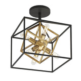 A modern ceiling light fixture with intersecting black and gold geometric frames, featuring exposed bulbs arranged in a starburst pattern at the center.