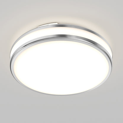 The Artika Hemisphere 15 in. LED flush mount light features a modern round design with chrome trim, five selectable color temperatures (CCT), adjustable brightness, and a white illuminated center, perfect for smooth white ceilings.